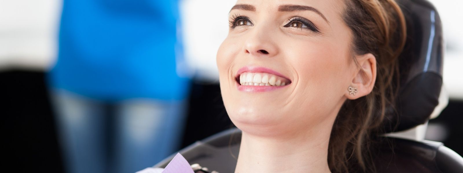Girl in dental chair smiling.